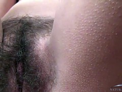 Dominika fondels her hairy pussy until she cums