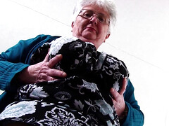 Fat granny Caroline V caresses her pussy