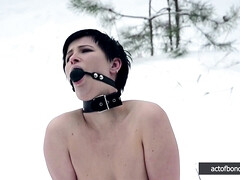 Naked barefoot Claudia chained in the snow