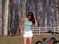 Paisley Rae is rubbing her bald pussy and drilling it with a huge, pink dildo