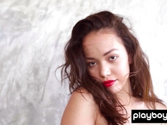 Nude Filipino muse posing with huge leaf