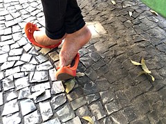 Candid girl feet in street