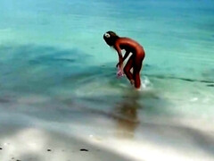 Victoria Tiffani gets naked on the beach and sucks a hard cock
