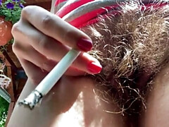 hairy bush smoking outdoor two cigarettes