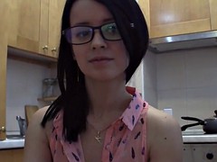 Splendid teen with glasses chatting in the kitchen