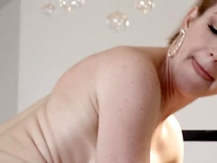 Big-boobied MILF with short hair checks bald guy's cock in action