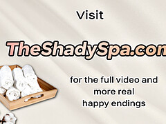 Oiled inked masseuse jerking client