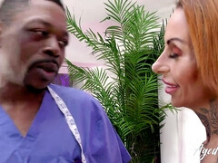 AGEDLOVE A doctor with the BBC examines a busty woman