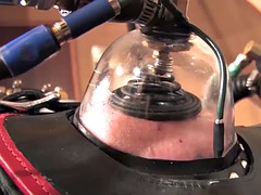 Latex BDSM femdom drains sissy cock with milking machine